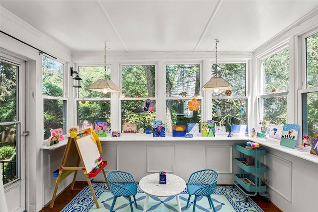 44 Kingsbury Rd, New Rochelle, NY 10804 - sunroom with wood finished floors and a decorative wall