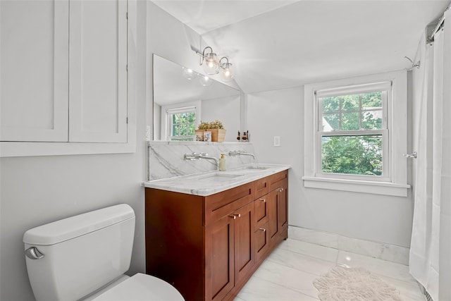 44 Kingsbury Rd, New Rochelle, NY 10804 - full bathroom with plenty of natural light, double vanity, and marble finish flooring