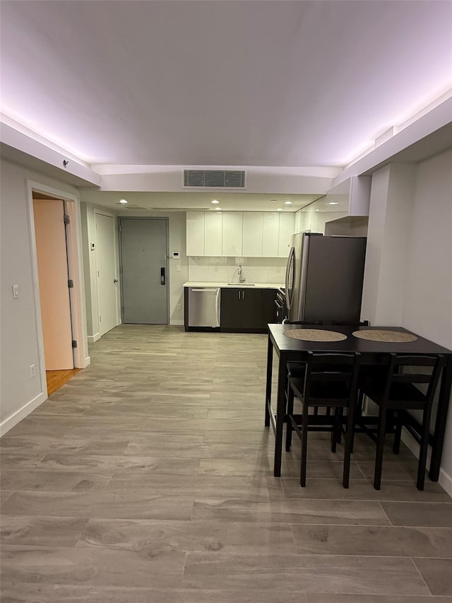 158-15 Union Tpke Unit 204N, Fresh Meadows, NY 11366 - dining room featuring light wood-type flooring and baseboards