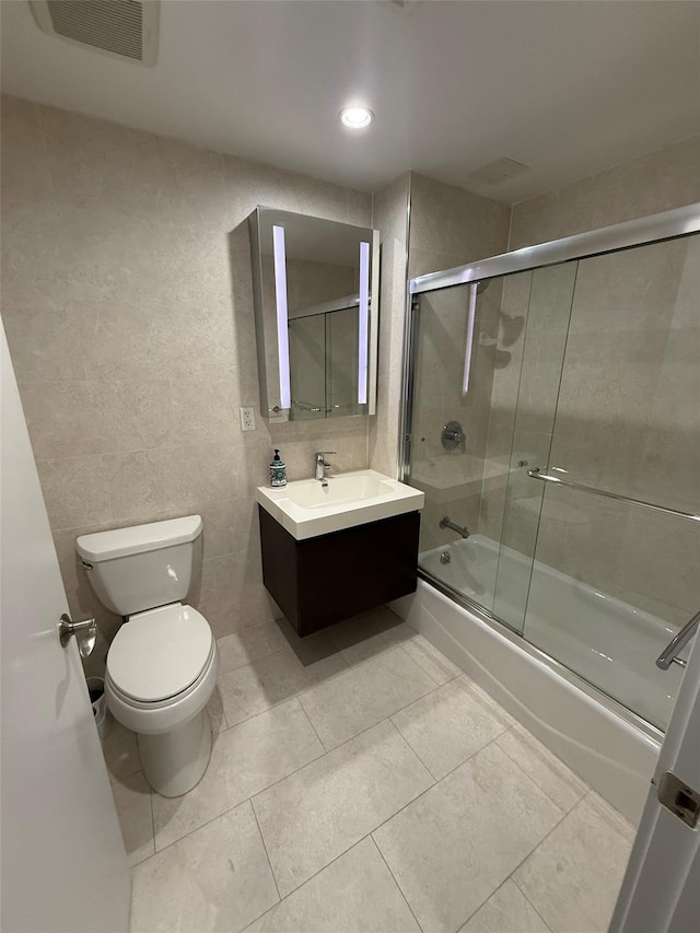 158-15 Union Tpke Unit 204N, Fresh Meadows, NY 11366 - bathroom featuring bath / shower combo with glass door, vanity, tile patterned flooring, and recessed lighting