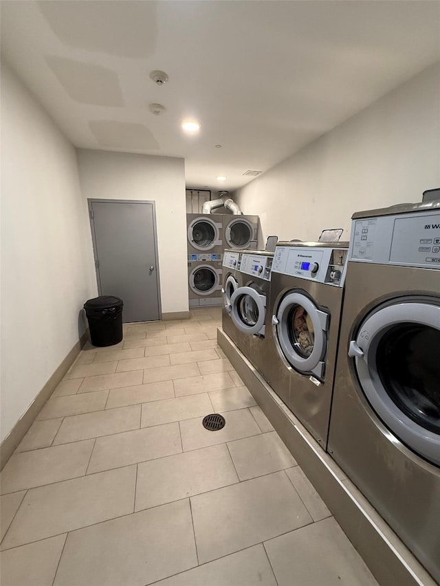 158-15 Union Tpke Unit 204N, Fresh Meadows, NY 11366 - shared laundry featuring estacked washer and dryer, separate washer and dryer, and light tile patterned flooring