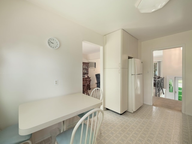 34 Crambrook Rd, New City, NY 10956 - kitchen featuring freestanding refrigerator, white cabinetry, and light flooring