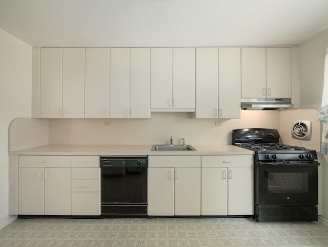 34 Crambrook Rd, New City, NY 10956 - kitchen with black appliances, under cabinet range hood, light countertops, and white cabinetry