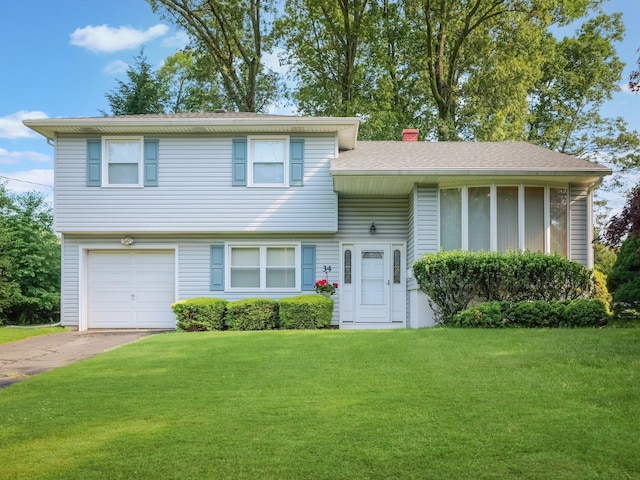 34 Crambrook Rd, New City, NY 10956 - tri-level home with an attached garage, a front yard, asphalt driveway, and a chimney