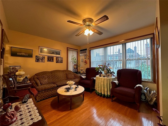 82-48 Eliot Ave, Middle Village, NY 11379 - living area featuring hardwood / wood-style flooring, ceiling fan, and a wall mounted AC
