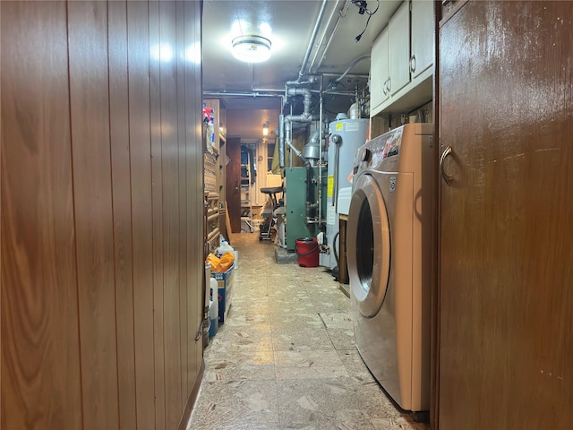 82-48 Eliot Ave, Middle Village, NY 11379 - washroom featuring washer / clothes dryer, water heater, cabinet space, and wooden walls