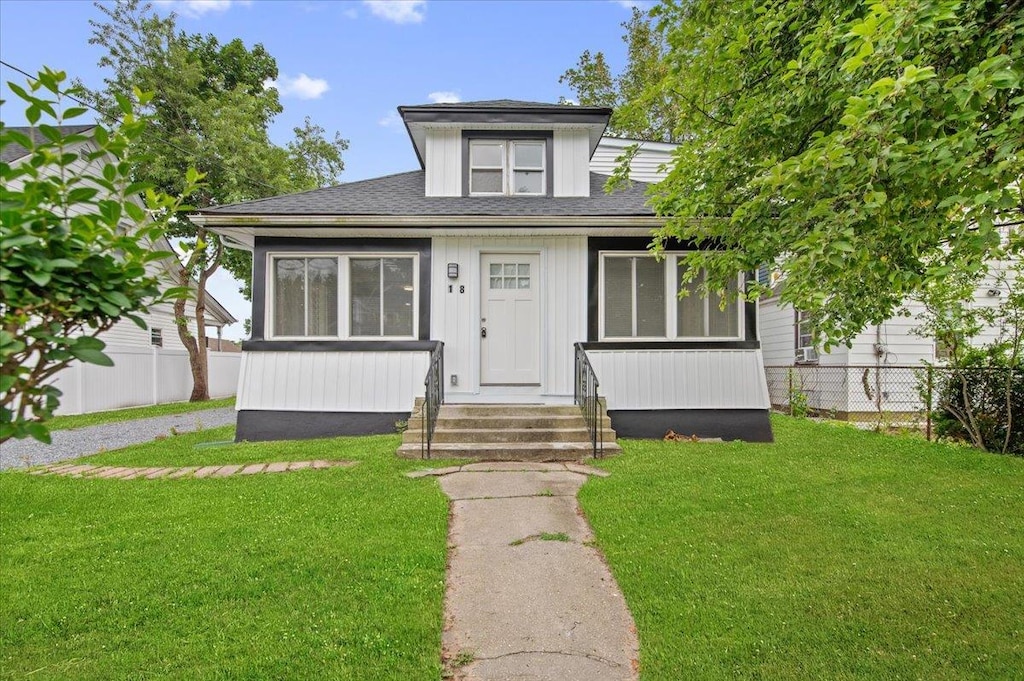 18 Evans Ave, Freeport, NY 11520 - bungalow-style house featuring a shingled roof