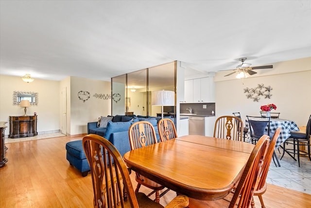 151-25 88th St Unit 1D, Howard Beach, NY 11414 - dining area featuring ceiling fan and a wood stove