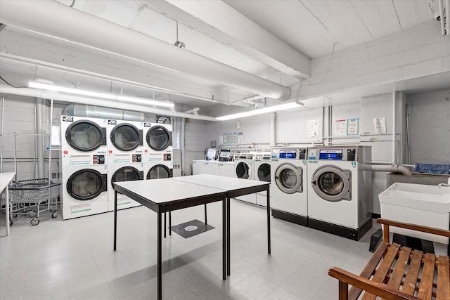 151-25 88th St Unit 1D, Howard Beach, NY 11414 - community laundry featuring stacked washer / drying machine, washer and dryer, and light flooring