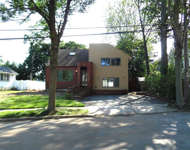 1064 Barbara Ct, North Bellmore, NY 11710 - view of front facade featuring entry steps and roof with shingles