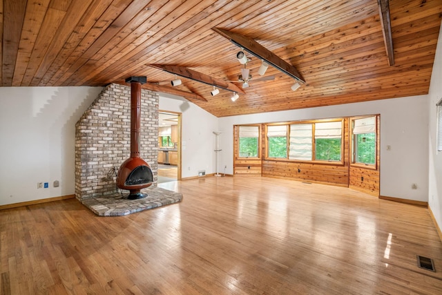 41 Colburn Dr, Poughkeepsie, NY 12603 - unfurnished living room featuring a wood stove, wooden ceiling, light wood-style floors, and ceiling fan