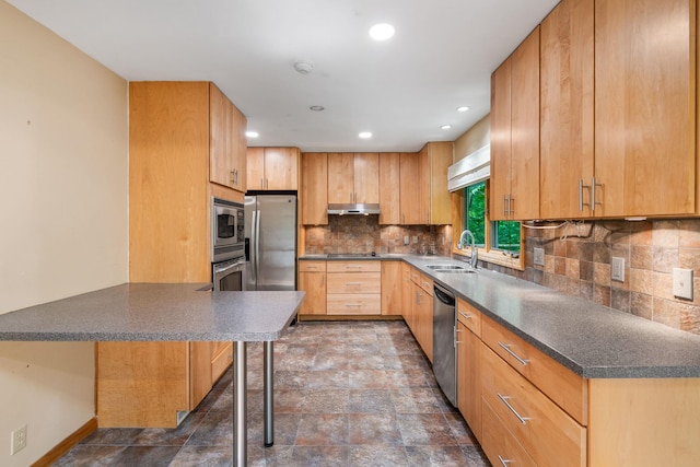 41 Colburn Dr, Poughkeepsie, NY 12603 - kitchen featuring stainless steel appliances, stone finish flooring, backsplash, dark countertops, and a peninsula