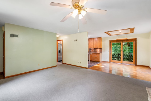 41 Colburn Dr, Poughkeepsie, NY 12603 - unfurnished living room with attic access, light carpet, and a ceiling fan