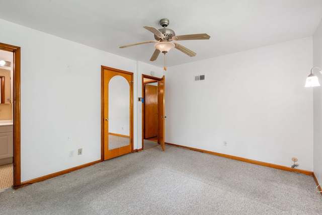 41 Colburn Dr, Poughkeepsie, NY 12603 - unfurnished bedroom featuring carpet flooring, connected bathroom, and a ceiling fan