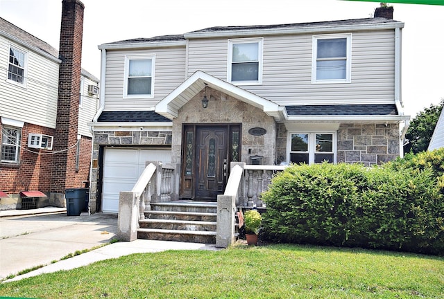 4723 164th St, Flushing, NY 11358 - townhome / multi-family property featuring a garage, stone siding, concrete driveway, a front lawn, and roof with shingles