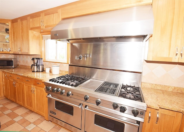 4723 164th St, Flushing, NY 11358 - kitchen featuring wall chimney exhaust hood, decorative backsplash, stainless steel appliances, and light stone counters