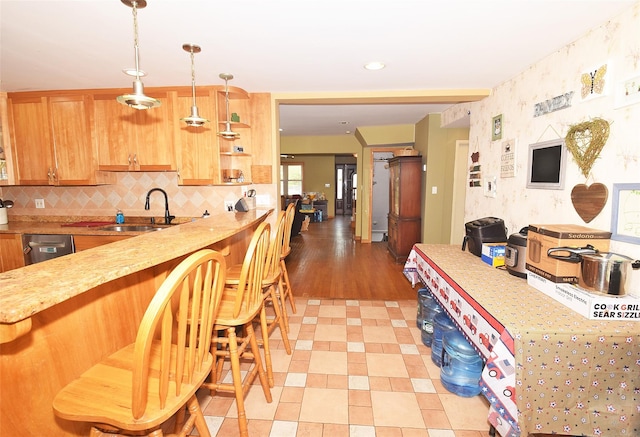 4723 164th St, Flushing, NY 11358 - kitchen featuring decorative light fixtures, open shelves, a breakfast bar area, light stone counters, and backsplash