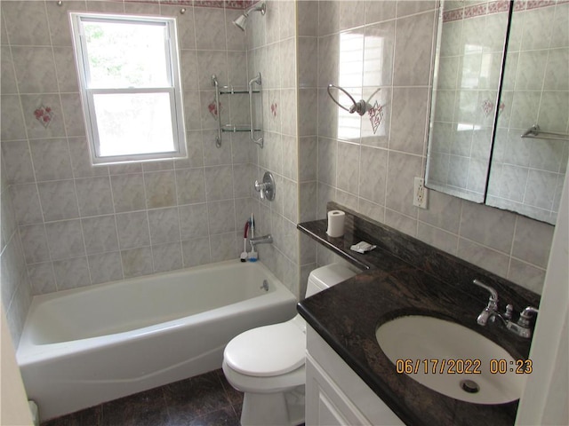 2 Leffingwell Pl, New Rochelle, NY 10801 - bathroom featuring healthy amount of natural light, vanity, tub / shower combination, tile patterned flooring, and tile walls