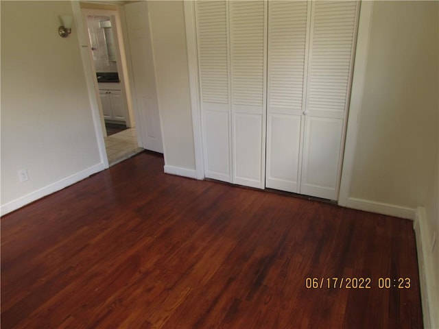 2 Leffingwell Pl, New Rochelle, NY 10801 - unfurnished bedroom featuring dark wood-style flooring and a closet
