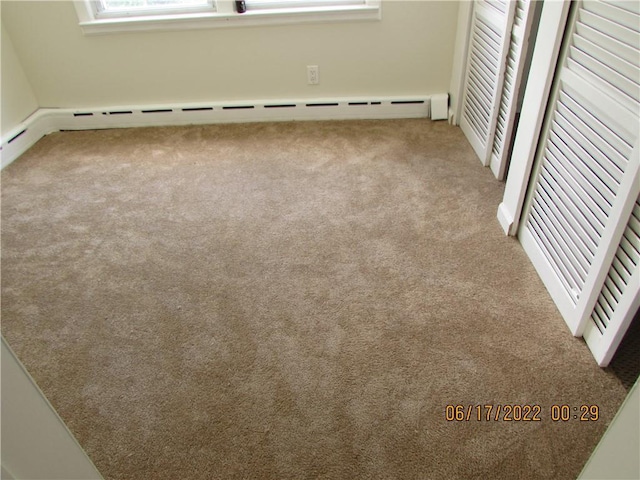 2 Leffingwell Pl, New Rochelle, NY 10801 - spare room with carpet floors and a baseboard heating unit