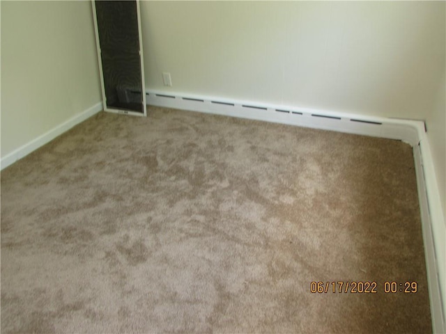 2 Leffingwell Pl, New Rochelle, NY 10801 - empty room with carpet floors and baseboard heating