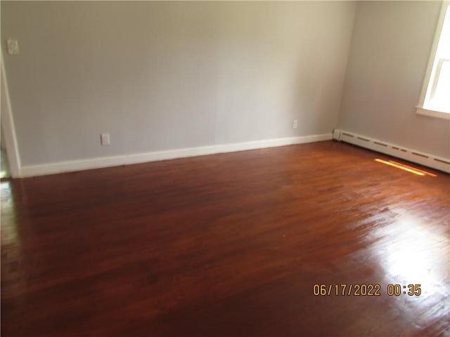 2 Leffingwell Pl, New Rochelle, NY 10801 - spare room with dark wood finished floors and a baseboard heating unit