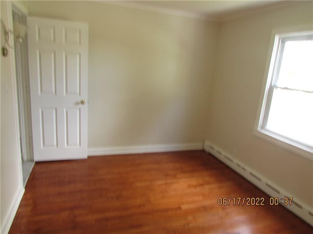 2 Leffingwell Pl, New Rochelle, NY 10801 - spare room featuring baseboard heating, healthy amount of natural light, wood finished floors, and ornamental molding