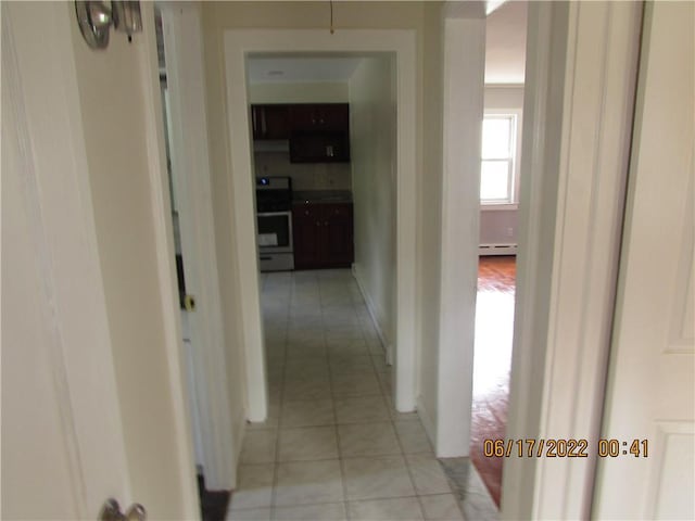 2 Leffingwell Pl, New Rochelle, NY 10801 - corridor with baseboard heating and light tile patterned floors