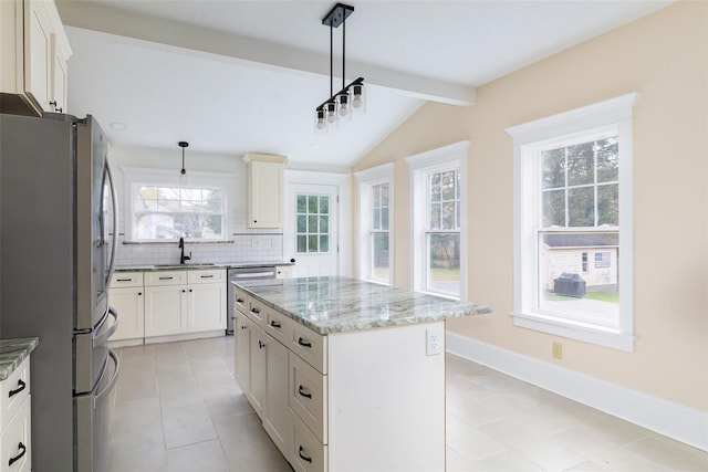32 Reservoir Dr, Millbrook, NY 12545 - kitchen with appliances with stainless steel finishes, light stone counters, backsplash, and light tile patterned floors