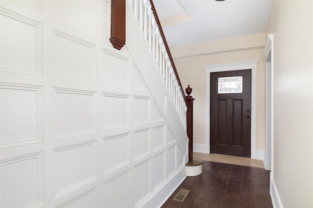32 Reservoir Dr, Millbrook, NY 12545 - entrance foyer featuring stairway and dark wood-type flooring