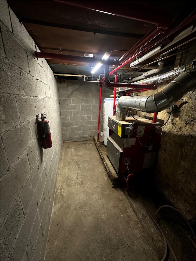 1661 E 172nd St, Bronx, NY 10472 - unfinished below grade area with electric water heater and concrete block wall
