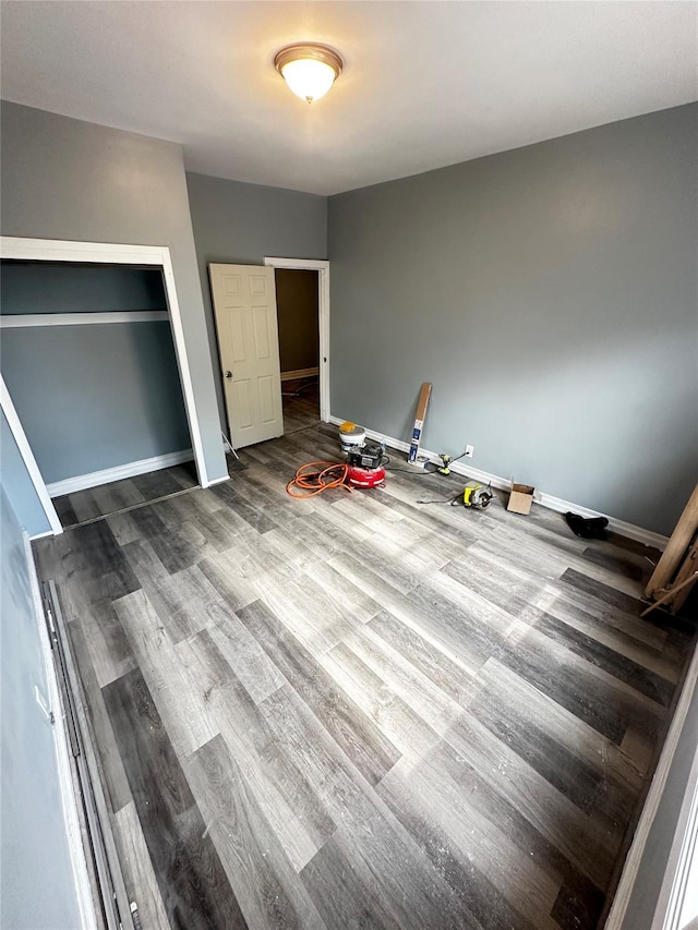 1661 E 172nd St, Bronx, NY 10472 - unfurnished bedroom featuring wood finished floors and baseboards