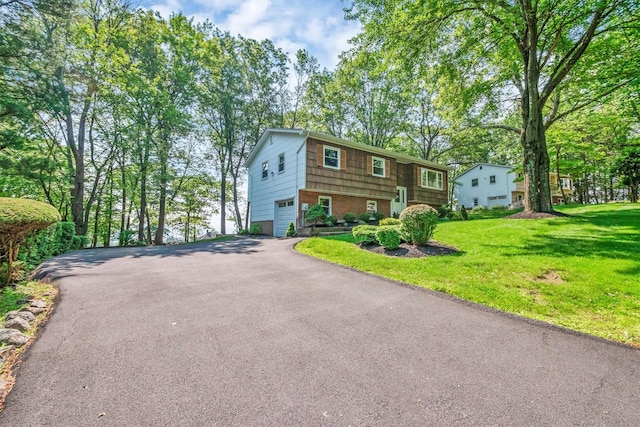 17 Woodrum Dr, Stony Point, NY 10980 - bi-level home featuring driveway, a garage, and a front yard