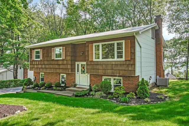 17 Woodrum Dr, Stony Point, NY 10980 - raised ranch with a chimney and a front lawn