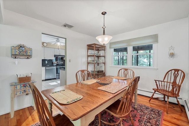 17 Woodrum Dr, Stony Point, NY 10980 - dining room with light wood-style floors, ceiling fan, and baseboard heating