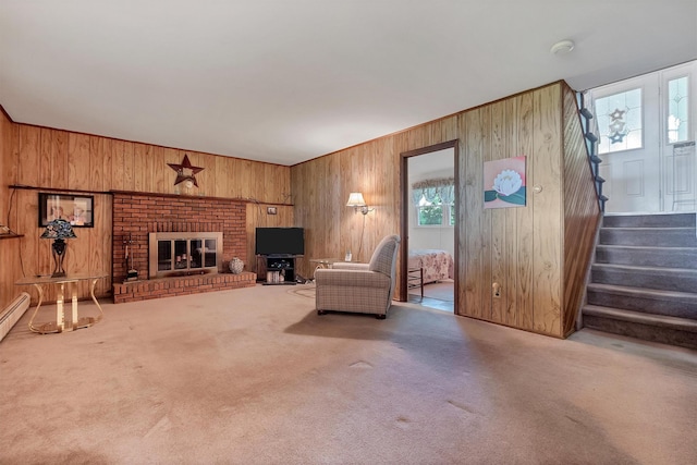 17 Woodrum Dr, Stony Point, NY 10980 - unfurnished living room featuring wood walls, stairway, carpet flooring, and a brick fireplace