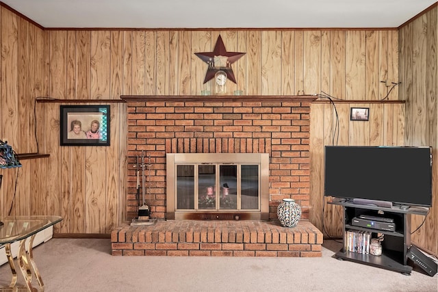 17 Woodrum Dr, Stony Point, NY 10980 - living room with carpet floors, wood walls, a baseboard radiator, and a brick fireplace