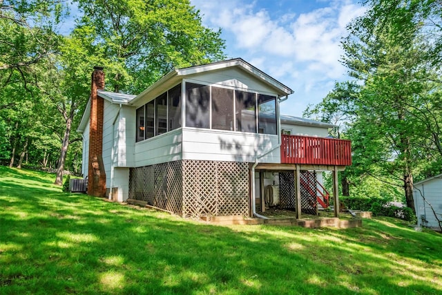 17 Woodrum Dr, Stony Point, NY 10980 - back of house with a chimney, a sunroom, a yard, and a deck