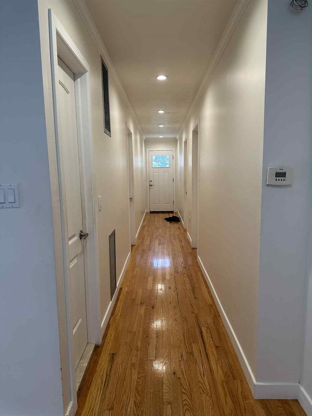 2936 216th St, Bayside, NY 11360 - hallway with wood finished floors, crown molding, and recessed lighting