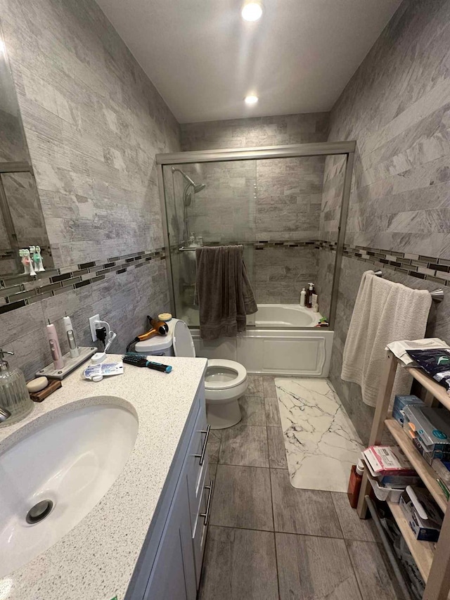 2936 216th St, Bayside, NY 11360 - bathroom with tile walls, vanity, and enclosed tub / shower combo