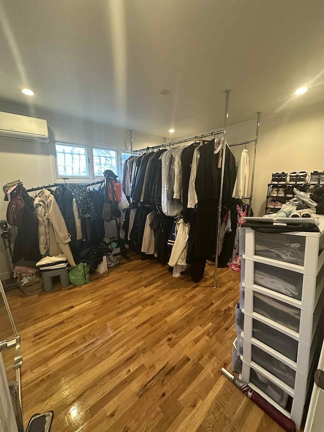 2936 216th St, Bayside, NY 11360 - walk in closet with an AC wall unit and wood finished floors