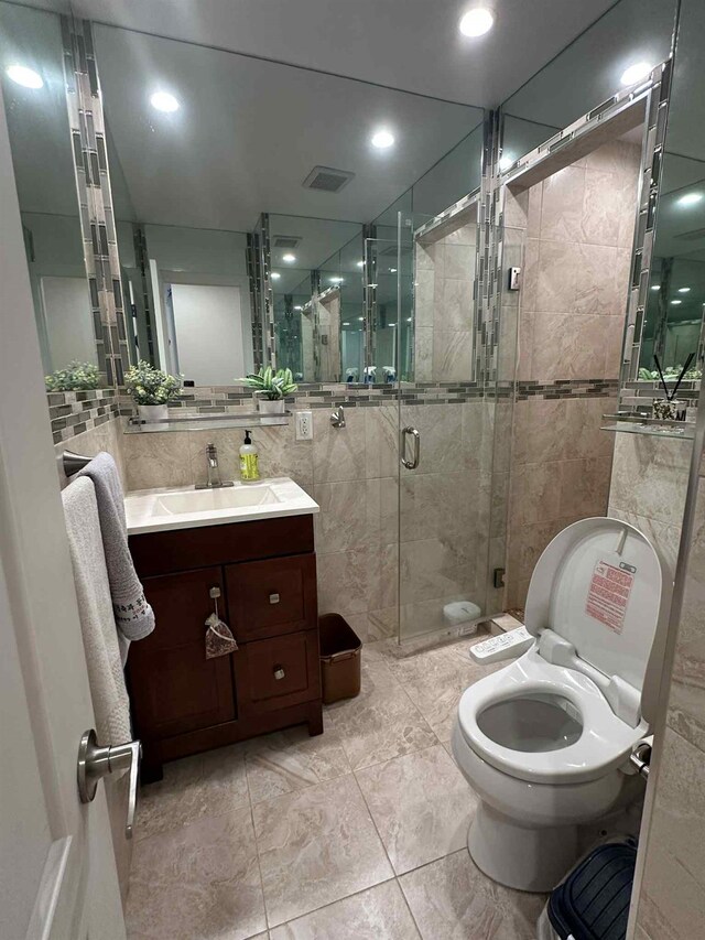 2936 216th St, Bayside, NY 11360 - bathroom with tile walls, vanity, and a stall shower