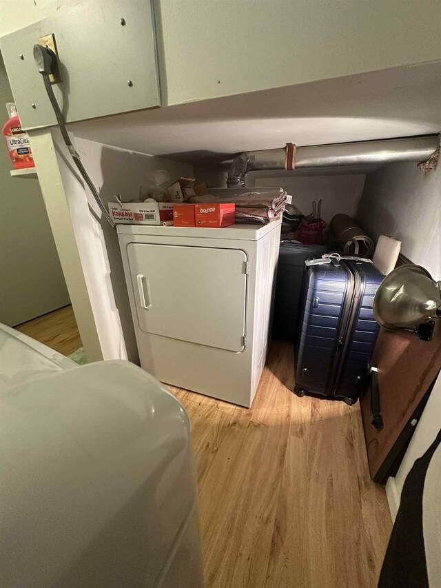 2936 216th St, Bayside, NY 11360 - laundry room with washer / clothes dryer, cabinet space, and light wood-style flooring