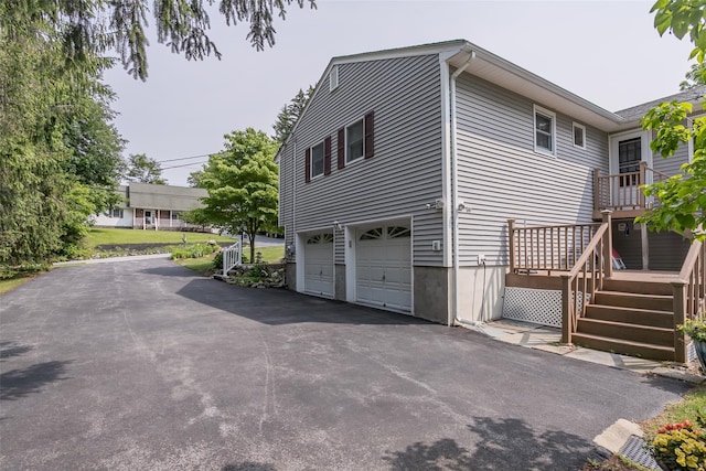2 Valley View Cir, Warwick, NY 10990 - view of property exterior with asphalt driveway, an attached garage, and a wooden deck