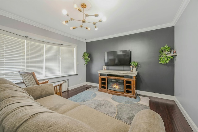 2 Janet Ln, Commack, NY 11725 - living room with wood finished floors, a chandelier, ornamental molding, and a glass covered fireplace
