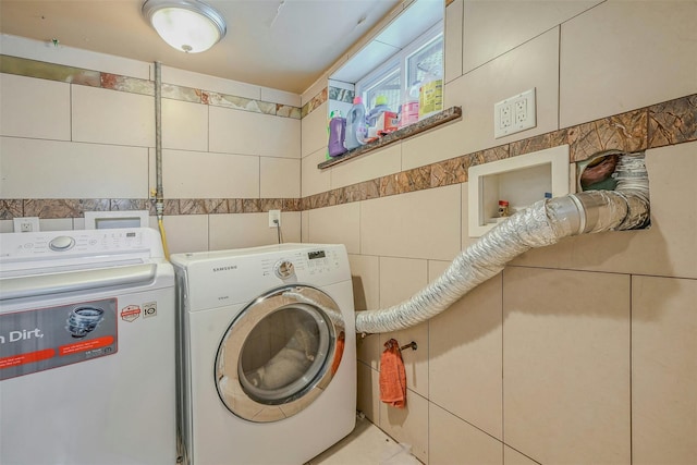 2 Janet Ln, Commack, NY 11725 - laundry area featuring washer and dryer and tile walls