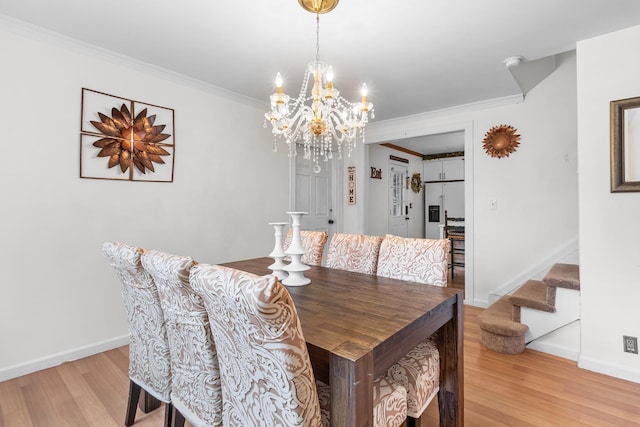 121 Thomas Ave, Bethpage, NY 11714 - dining area with stairway, light wood-style flooring, a chandelier, and ornamental molding