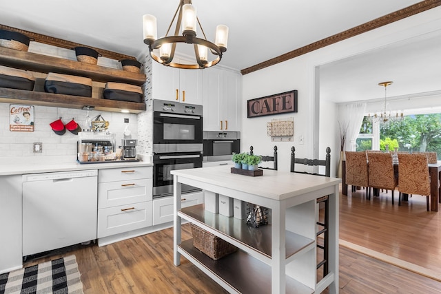 121 Thomas Ave, Bethpage, NY 11714 - kitchen featuring white dishwasher, a chandelier, double oven, open shelves, and white cabinets
