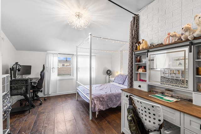 121 Thomas Ave, Bethpage, NY 11714 - bedroom featuring dark wood-style flooring, an office area, vaulted ceiling, and a chandelier