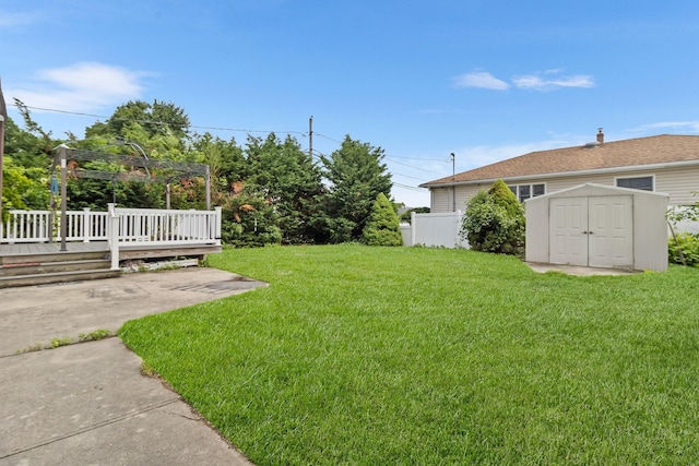 121 Thomas Ave, Bethpage, NY 11714 - view of grassy yard featuring a wooden deck, a storage unit, and a patio area